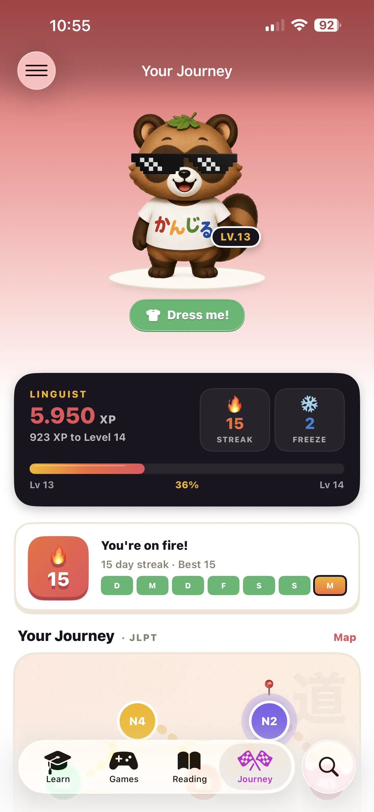 Hane Journey tab with the tanuki mascot, XP level progress, streak calendar, and JLPT level map