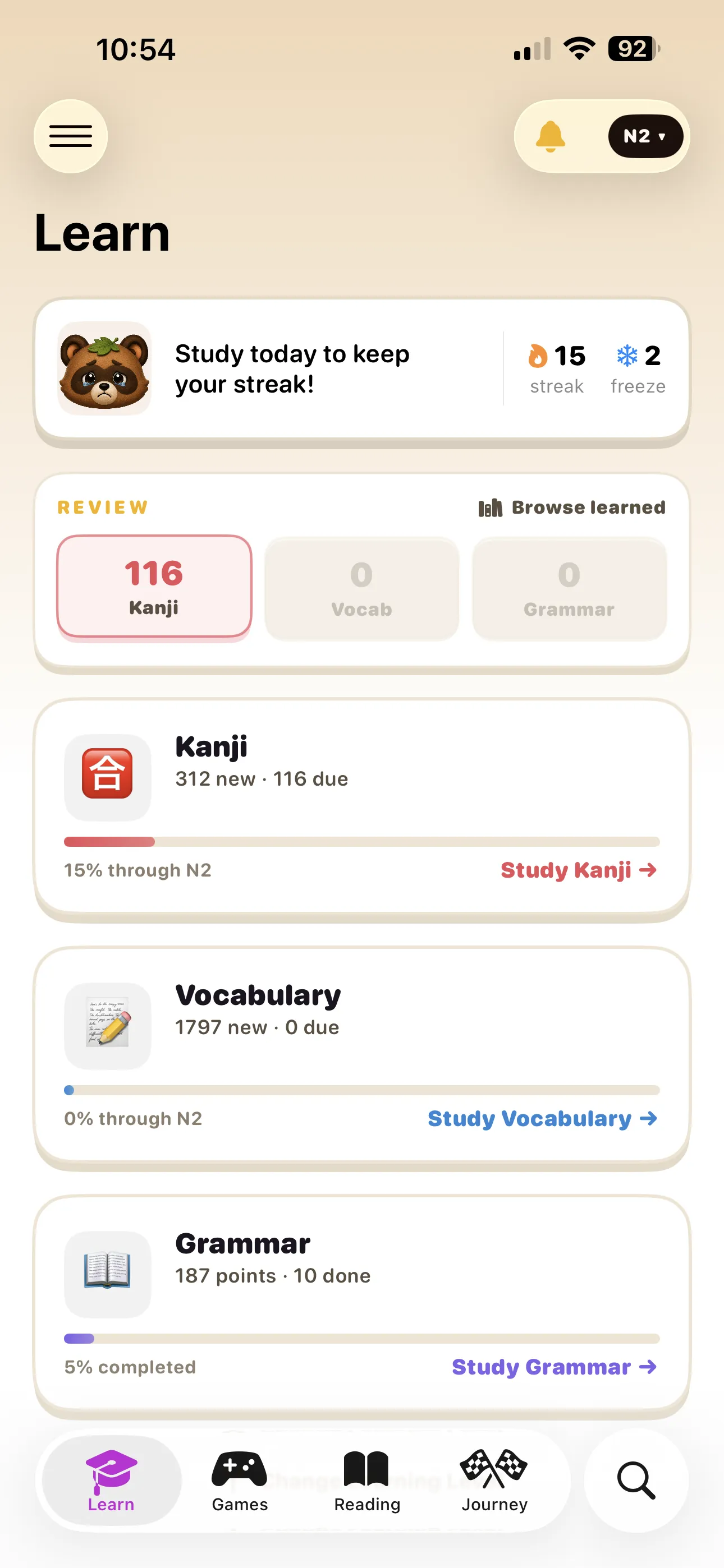 Hane iPhone app screenshot of the Learn tab showing daily streak, reviews, and JLPT N2 kanji, vocabulary, and grammar progress